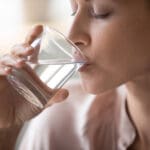 Side,View,Head,Shot,Close,Up,Young,Woman,Drinking,Pure