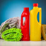 Colorful,Cleaning,Equipment,On,Table,And,Blue,Background