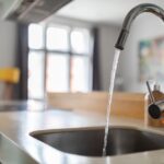Close,Up,Shot,Of,Modern,Kitchen,Faucet,With,Water,Running